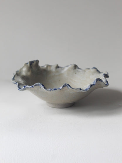 FOOTED CORAL BOWL WITH BLUE LINING