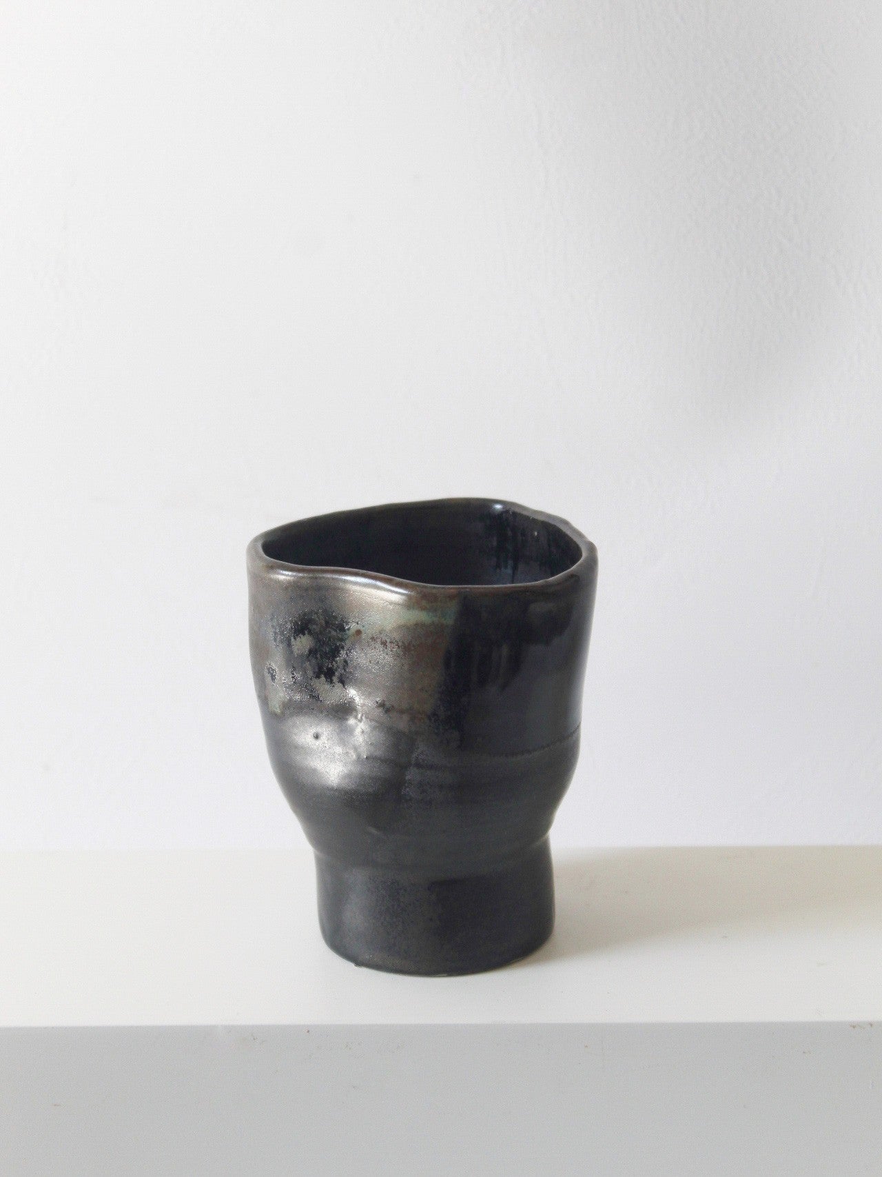 DENTED FOOTED CUP IN RUSTY BLACK